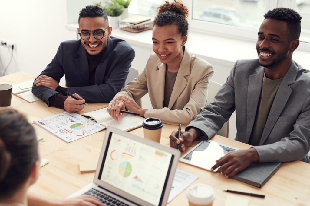 Three people working to build relationships with customers