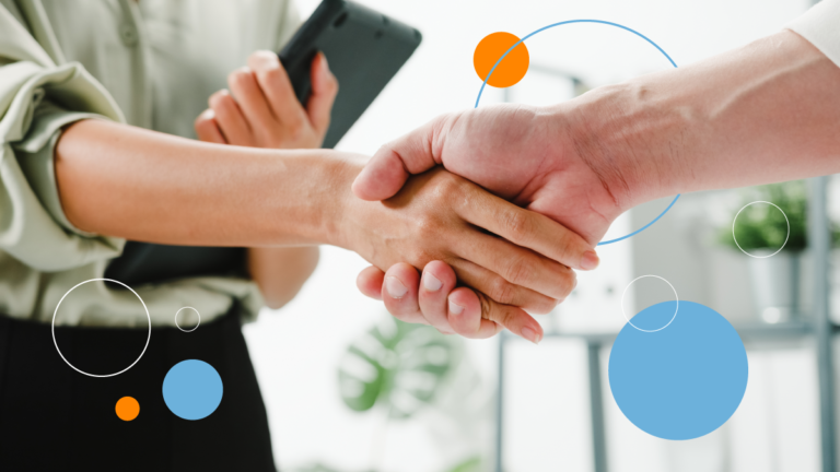 Two people shaking hands as a way of closing a deal thanks to localisation in business